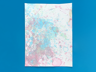 An abstract painting made by blowing bubbles