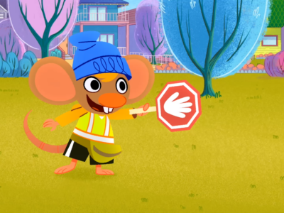 Stu signals with a stop sign